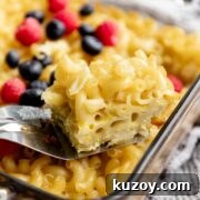 Baked Sweet Pasta and Egg Casserole Recipe 11 Baked Sweet Pasta Eggs Casserole is a childhood dish and a major family pleaser. Every bite is loaded with pasta and eggs with a little hint of sweetness within each bite. #pasta #bakedpasta #onepotmeal #pastacasserole #dessertpasta #breakfast #olgainthekitchen