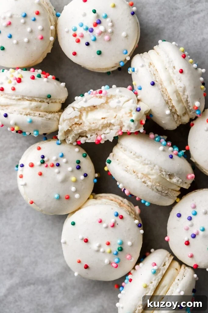 Mini Macarons: Bite-Sized French Cookie Recipes & Tips 2 mini macarons with sprinkles and a bite taken out