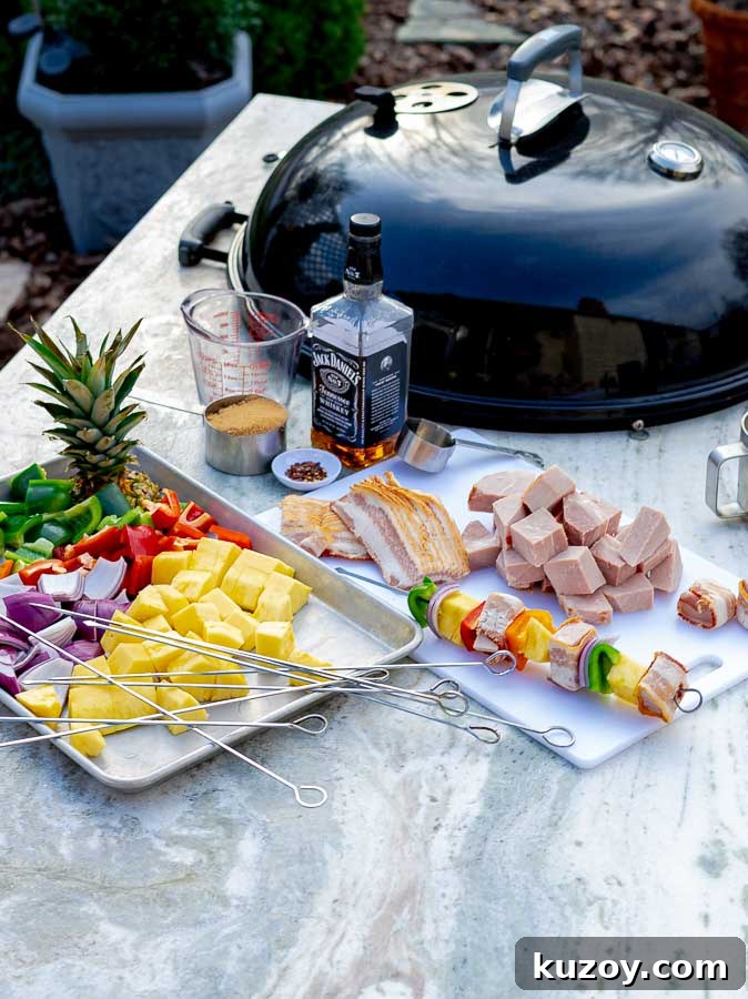 Grilled Bourbon Bacon, Ham & Pineapple Kabobs Recipe 4 raw ingredients for Bourbon Bacon Ham and Pineapple Kabobs ready for skewers