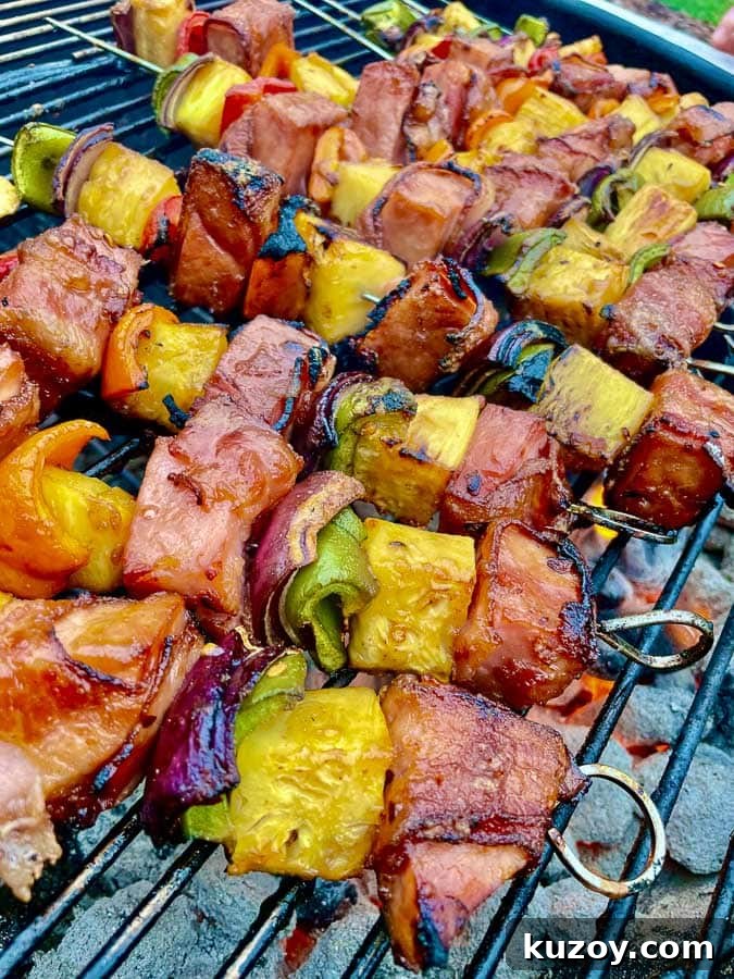 Grilled Bourbon Bacon, Ham & Pineapple Kabobs Recipe 6 closeup of Bourbon Bacon Ham and Pineapple Kabobs on the Grill