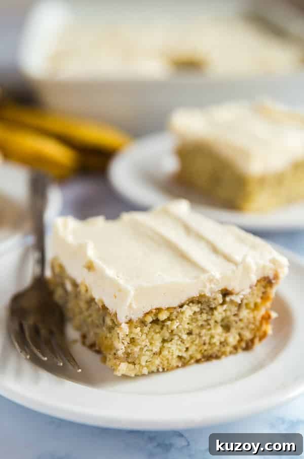 Classic Grandma’s Banana Cake Recipe for Moist, Flavorful Slices 5 Grandma's Best Banana Cake recipe on a plate with a fork on it.