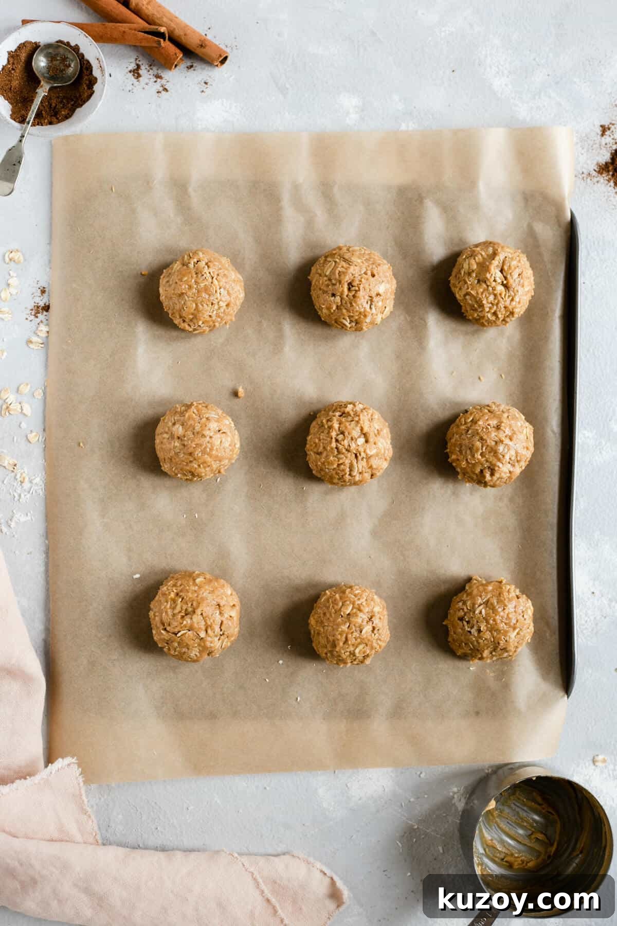 Coconut Peanut Butter Energy Bites with Warm Spices 5 Overhead shot of coconut and peanut butter spiced energy bites on a baking tray