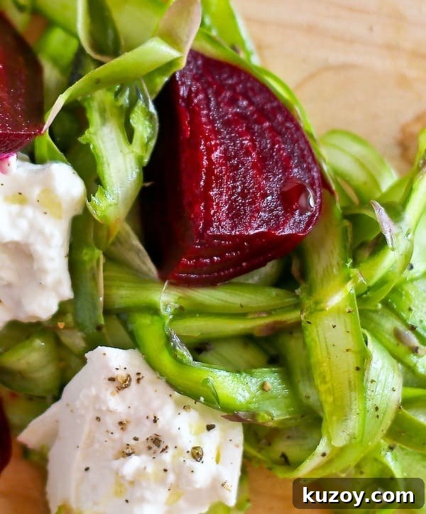 Asparagus Ribbon Salad with Beets and Creamy Burrata 4 Super closeup of roasted beet, asparagus ribbons, and burrata.