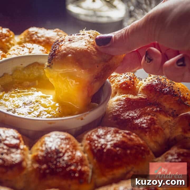 A roll of garlic bread dipped in melted camembert.