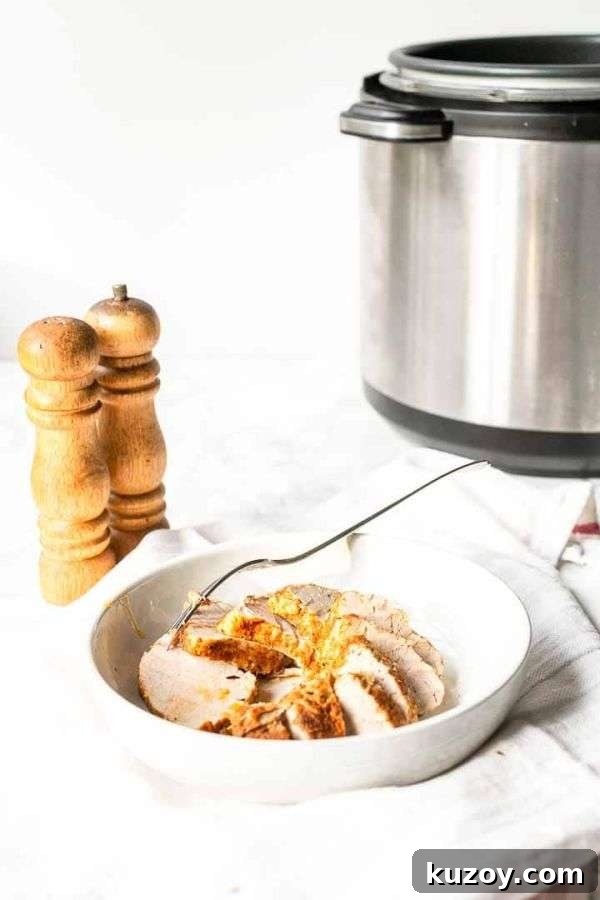 Instant Pot Pork Tenderloin: Juicy, Quick Weeknight Recipe 5 Pork tenderloin cut in slices and served in a white bowl.