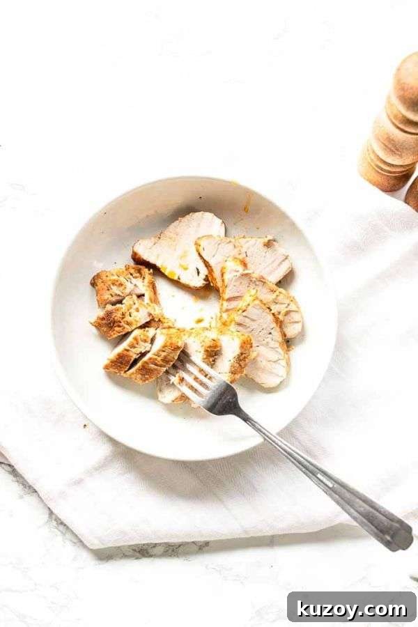 Instant Pot Pork Tenderloin: Juicy, Quick Weeknight Recipe 6 Slices of pork tenderloin with a fork in a white bowl