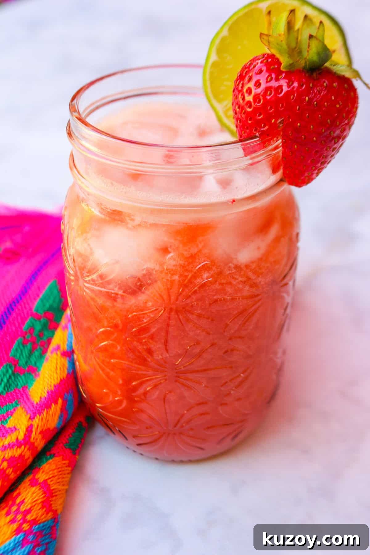 Refreshing Strawberry Limeade Recipe: Homemade Strawberry-Lime Cooler 9 Close up of Limonada de fresa in a glass