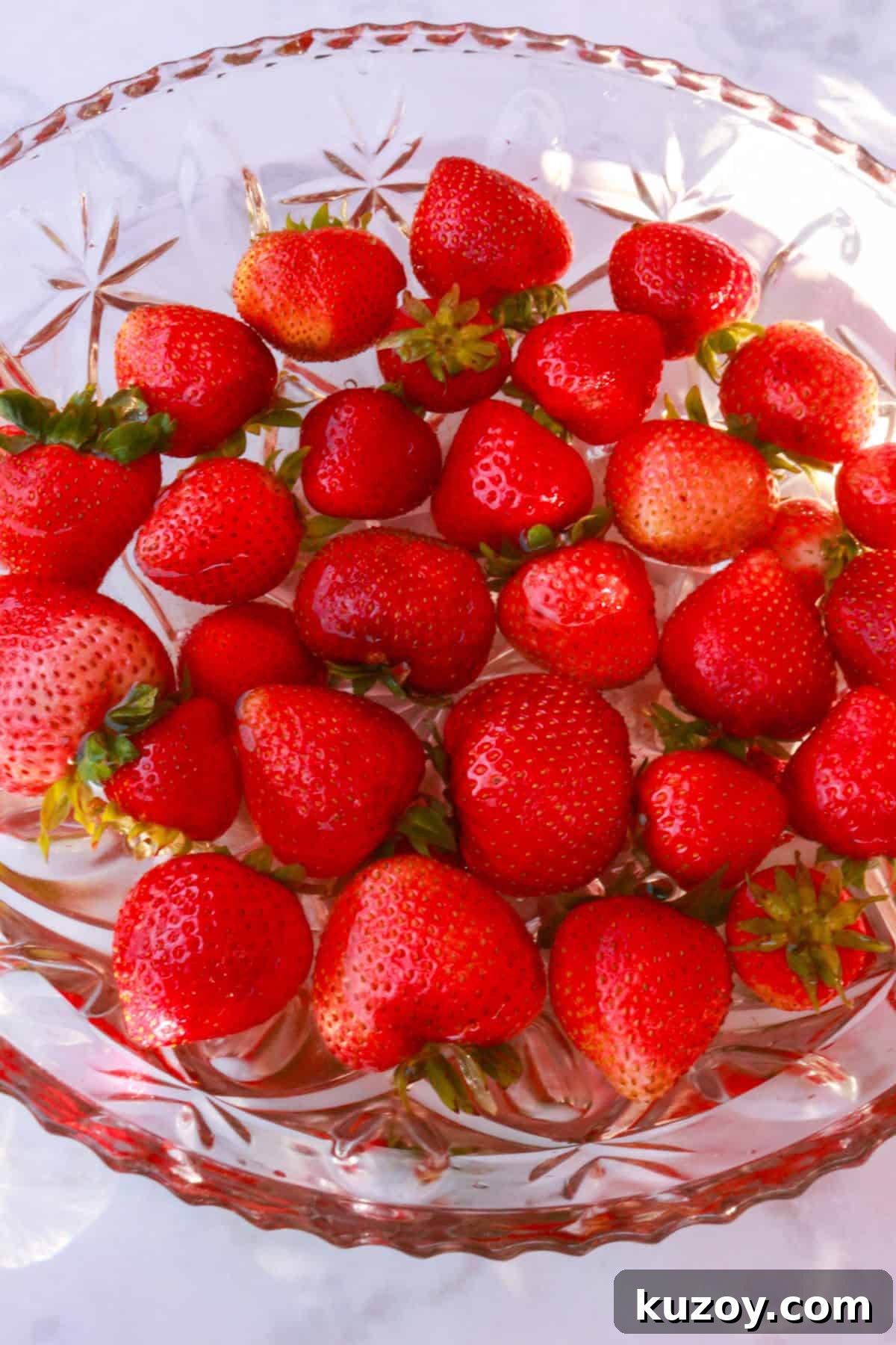 Refreshing Strawberry Limeade Recipe: Homemade Strawberry-Lime Cooler 5 A bowl with water and strawberries