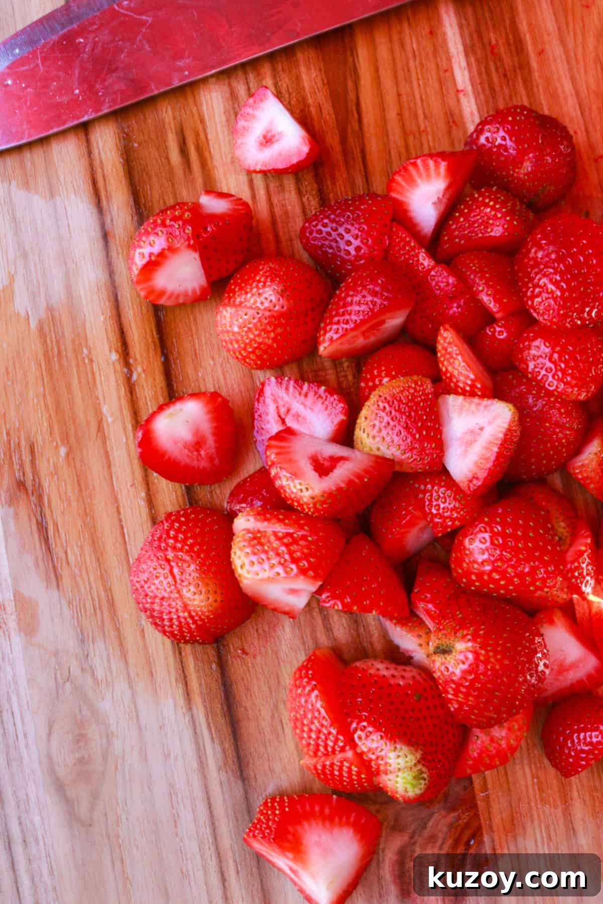 Refreshing Strawberry Limeade Recipe: Homemade Strawberry-Lime Cooler 6 cut strawberries on a wooden cutting board
