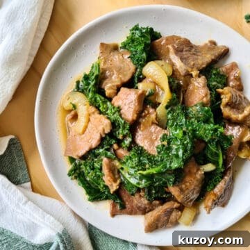 A plate of ginger beef and kale stir fry