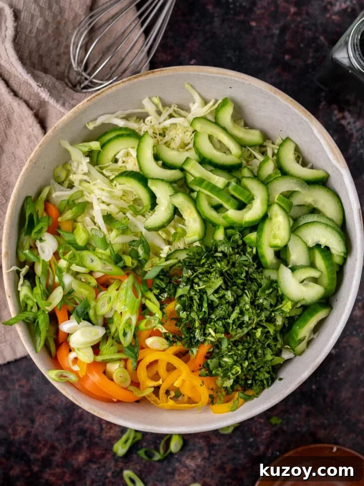 Asian Cucumber Slaw with Tangy Sweet Chili Dressing — Fresh Crunch and Zing 6 cucumber, peppers, green onions, cabbage and cucumbers added to the dressing