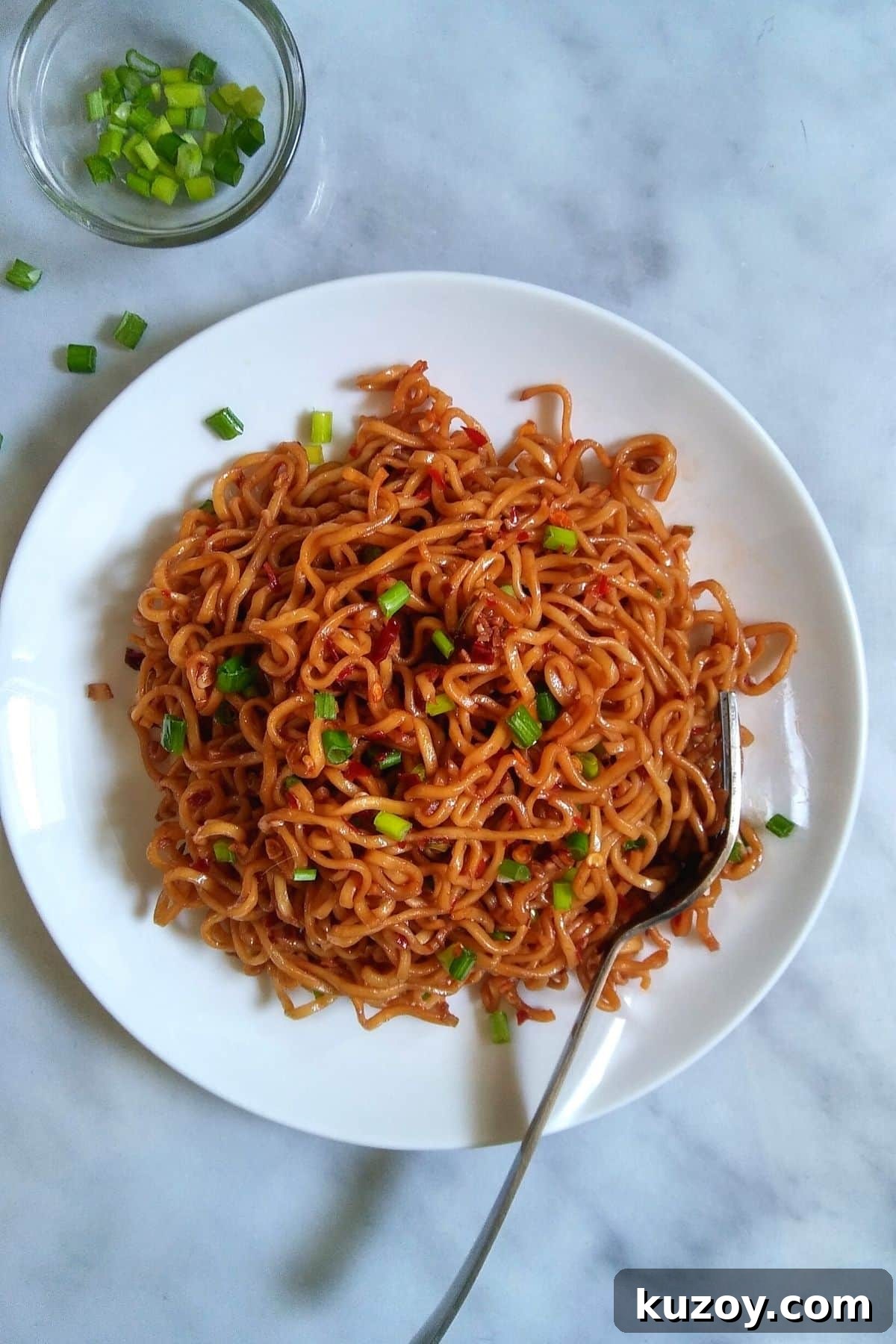 Image showing ramen noodles served on a white plate.