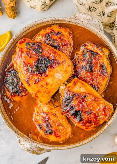 A bowl of honey soy baked chicken thighs.