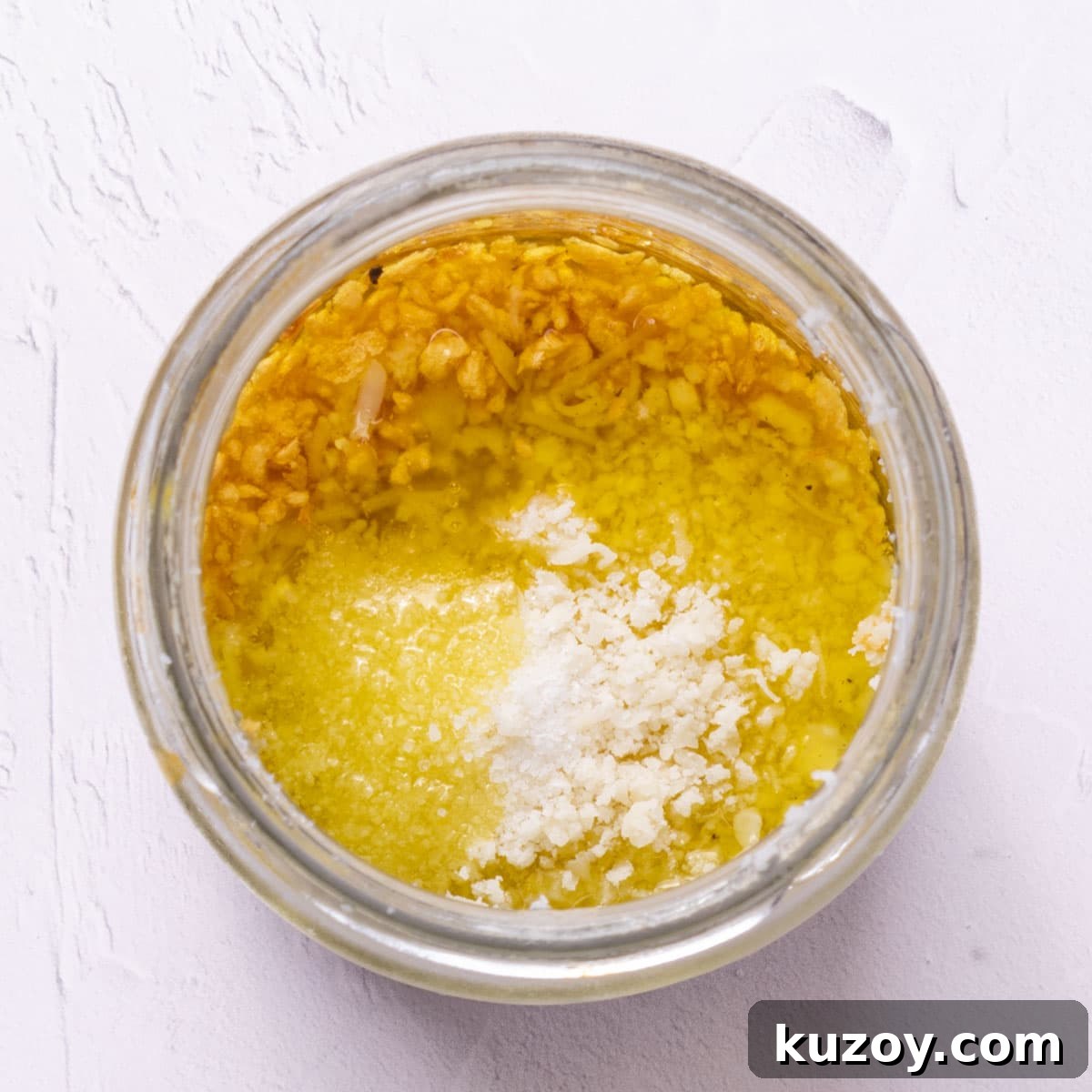 Toasted Garlic Salad with Crispy Garlic Dressing 6 Minced garlic in oil and salt in a glass jar.
