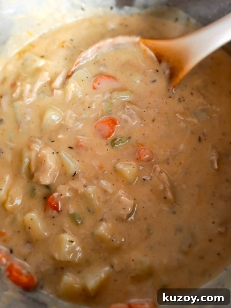 a big pot of Amish cheesy chicken chowder ready to eat.