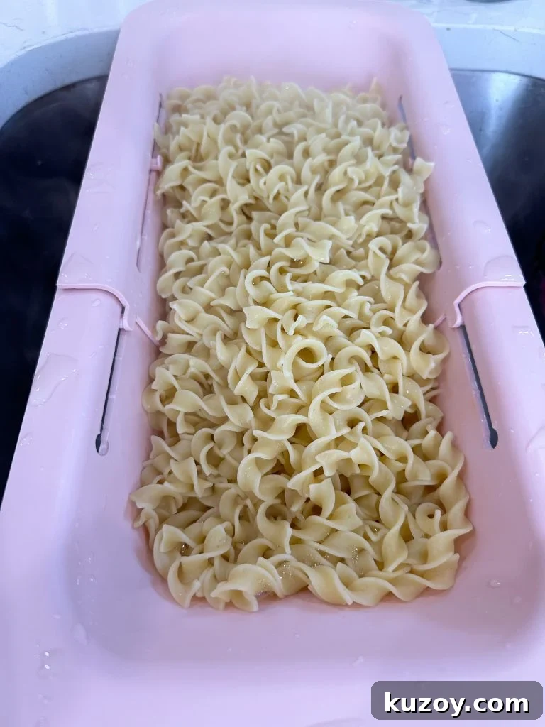 Dump-and-Bake Chicken Noodle Casserole Recipe for Busy Nights 4 Egg noodles in a colander