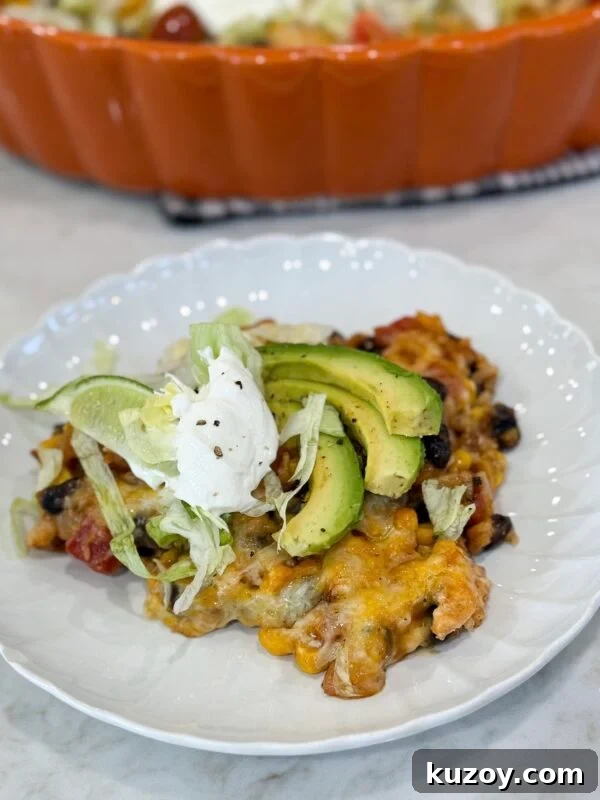 Dump-and-Bake Chicken Noodle Casserole Recipe for Busy Nights 8 Fiesta chicken casserole baked with melted cheese and colorful toppings