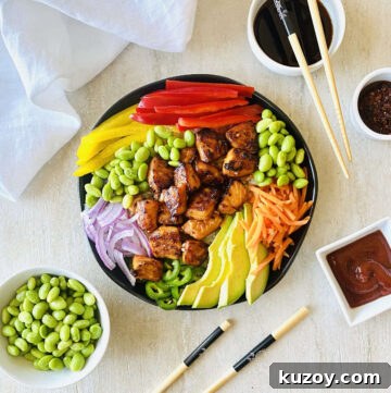 spicy salmon bowl with sriracha, soy sauce, chili oil and edamame