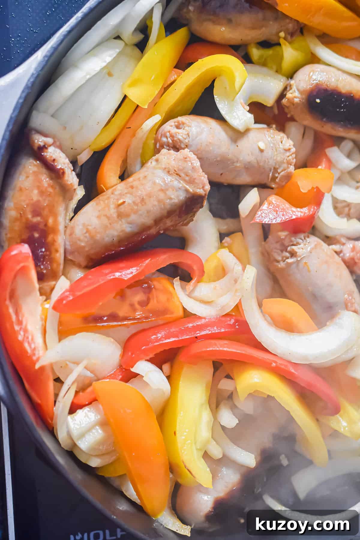 One-Pan Sausage and Peppers Recipe for Quick Weeknight Meals 8 The ingredients are mixed together in the pan.