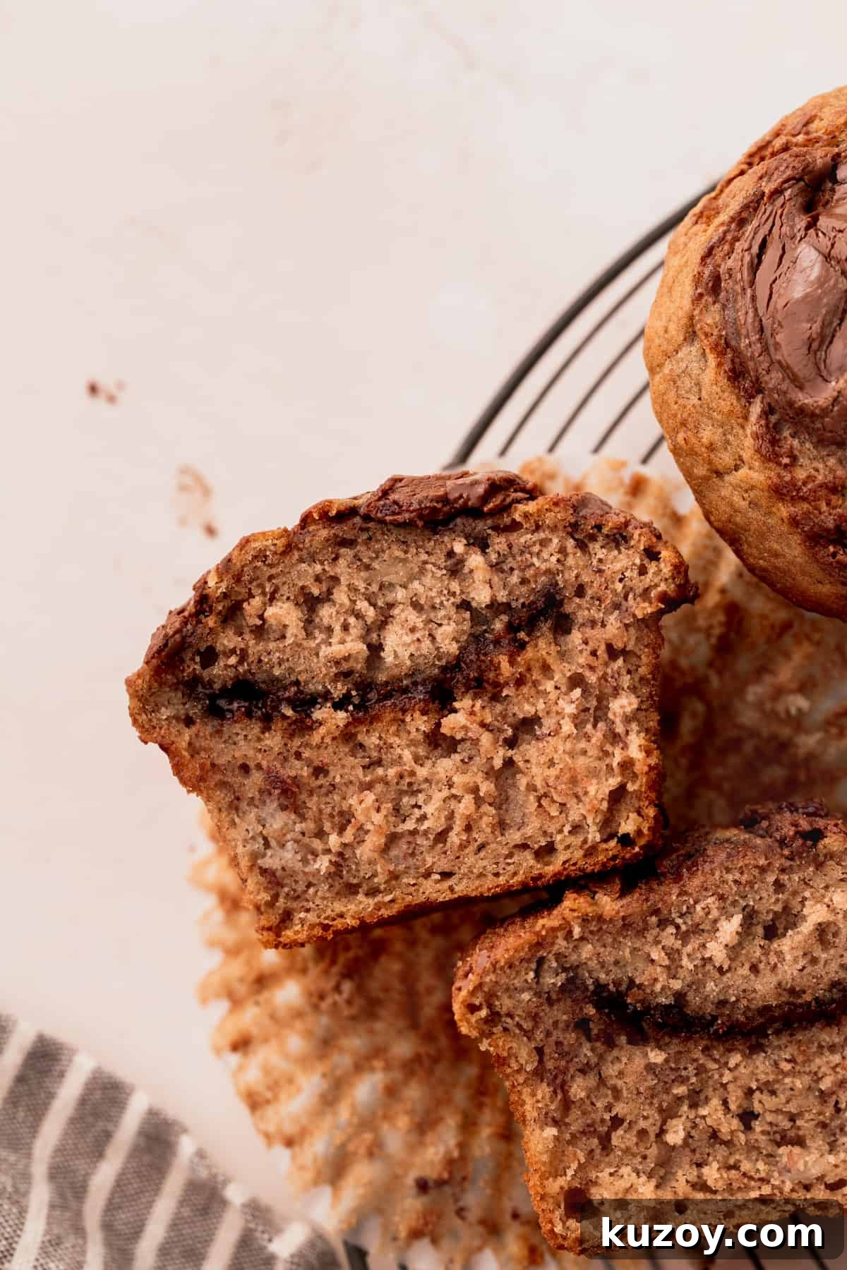 Nutella Banana Muffins Recipe — Gooey Chocolate Banana Muffins 11 Nutella muffin split in half.