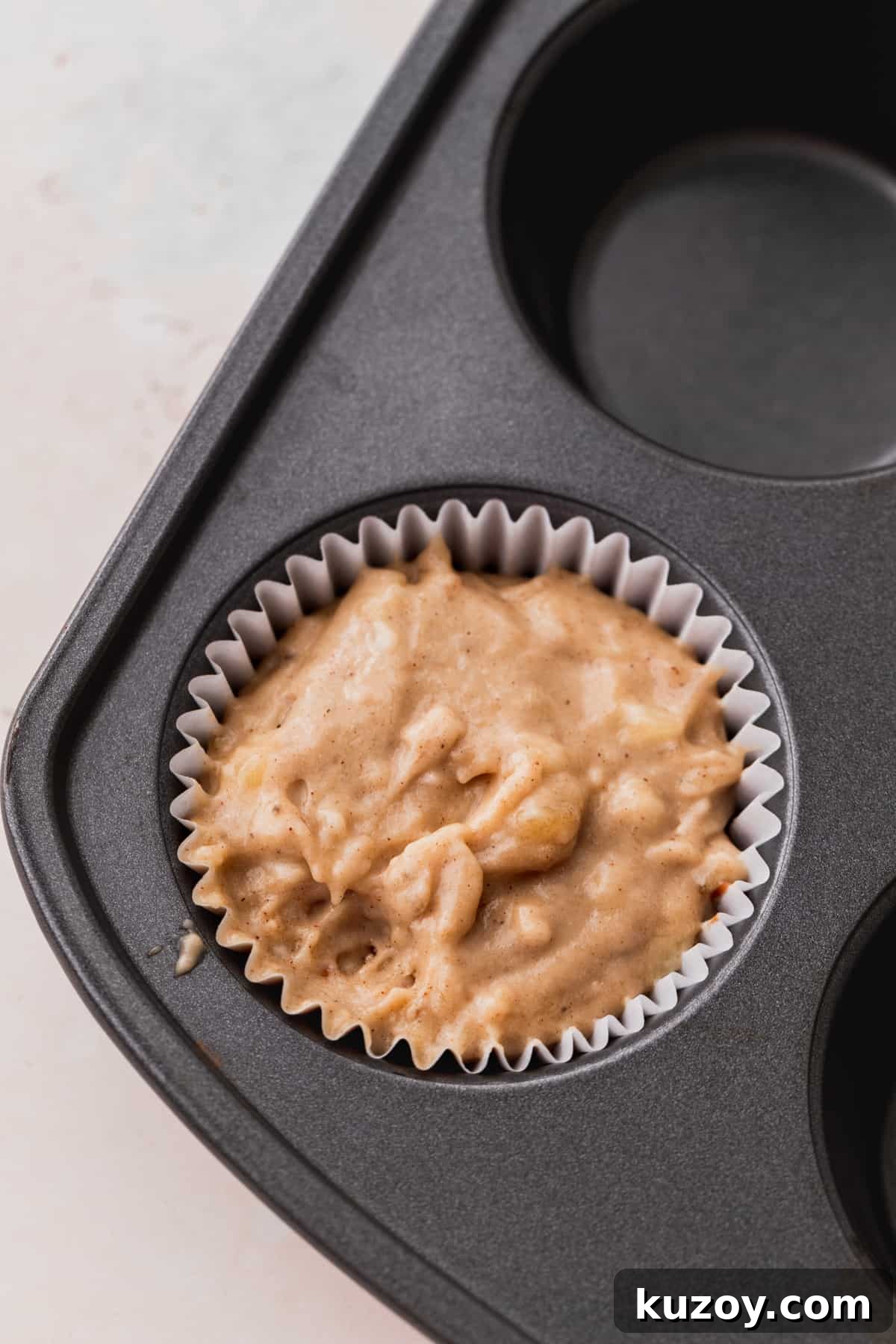 Nutella Banana Muffins Recipe — Gooey Chocolate Banana Muffins 8 Banana bread batter in the muffin pan.