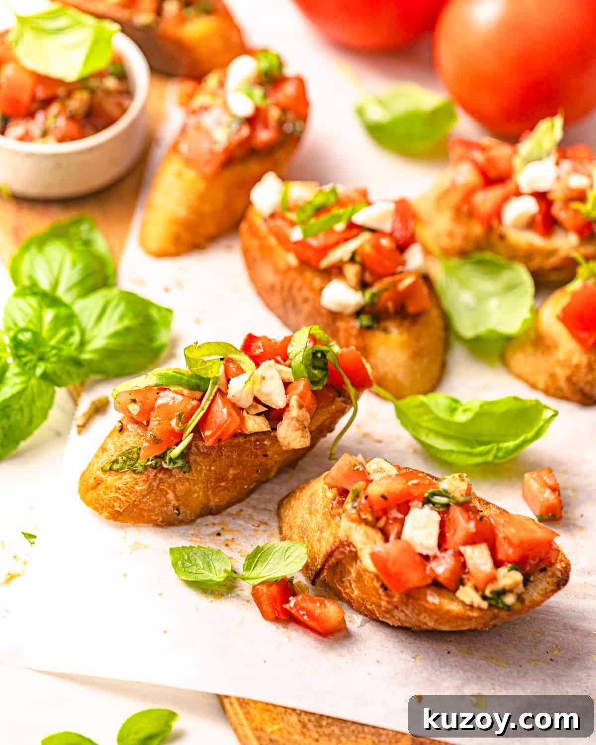 sliced bread topped with bruschetta and mozzarella.