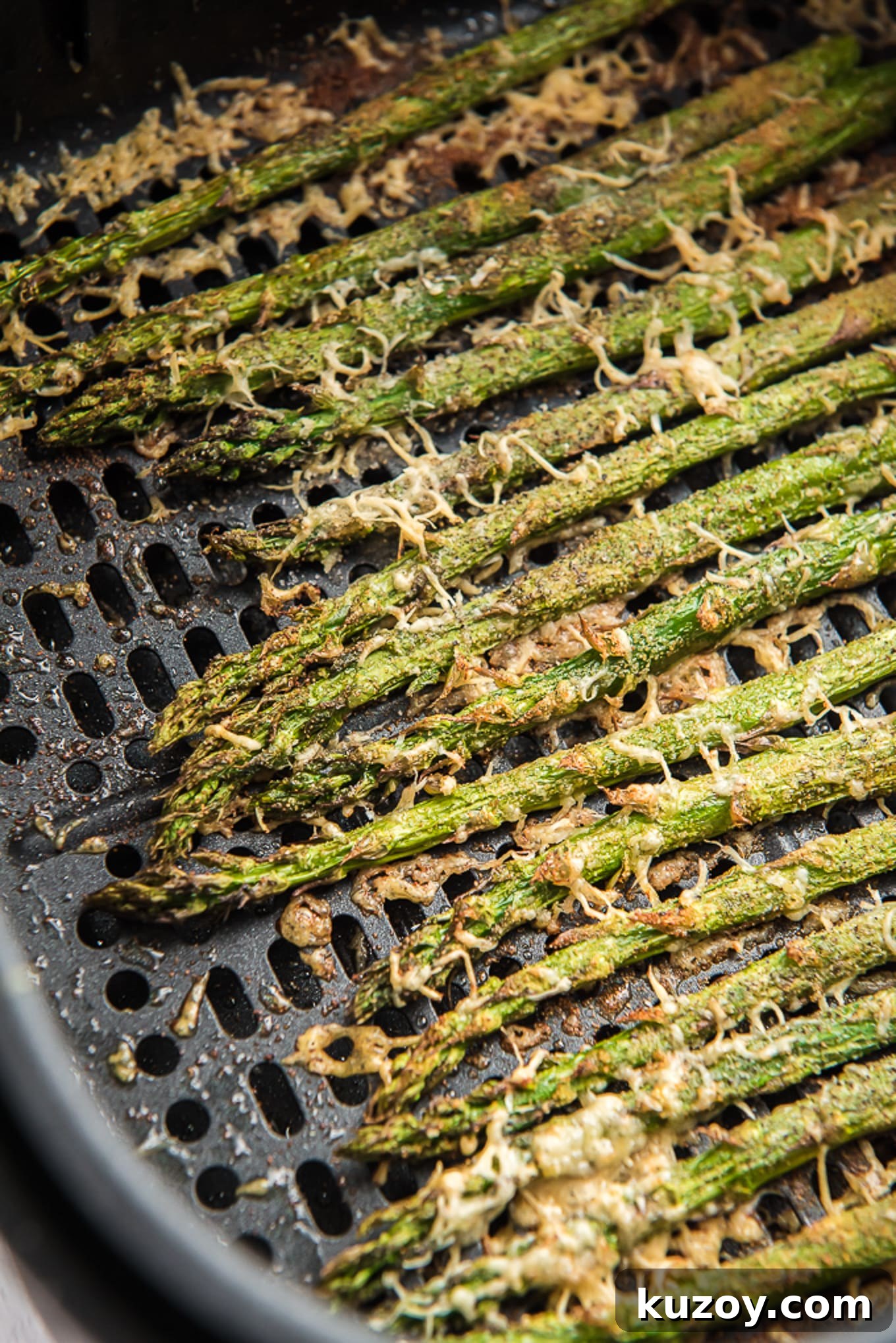 Crispy Air Fryer Asparagus Recipe with Garlic and Lemon 7 Crispy cooked asparagus with toasted parmesan cheese.