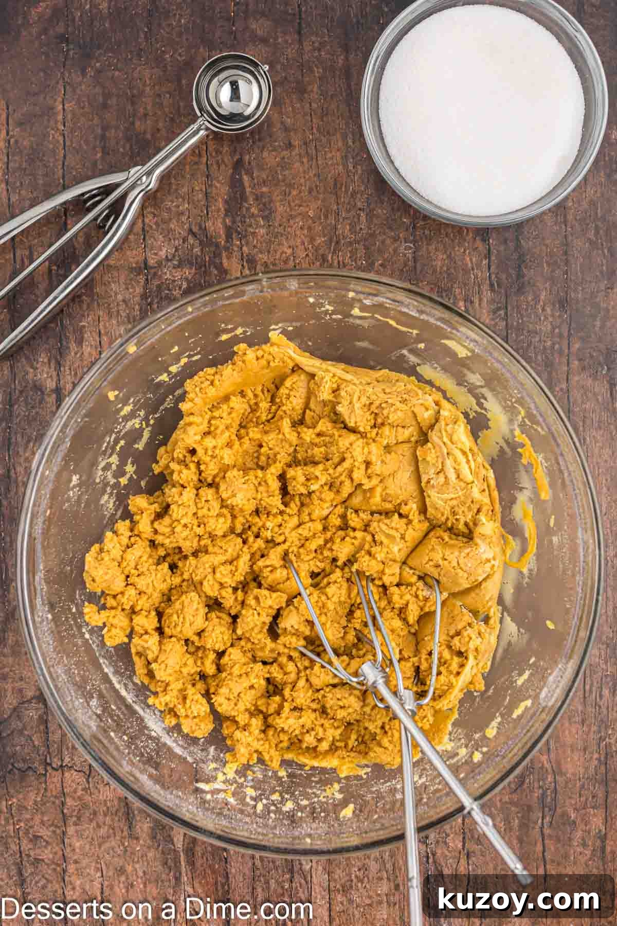 Mixing bowl with peanut butter dough mixture.