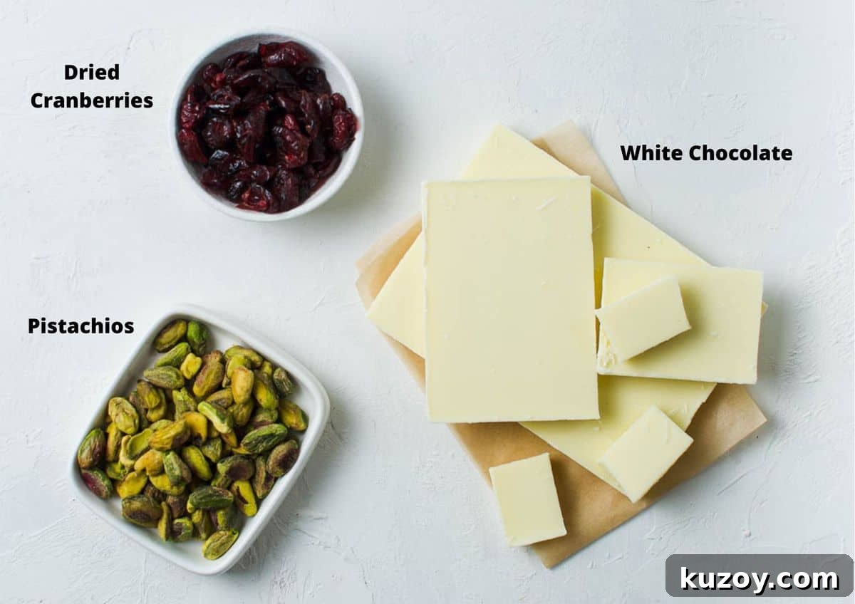 Cranberry Pistachio Chocolate Bark Recipe for Holiday Gifts 3 ingredients in this recipe on a white bench.