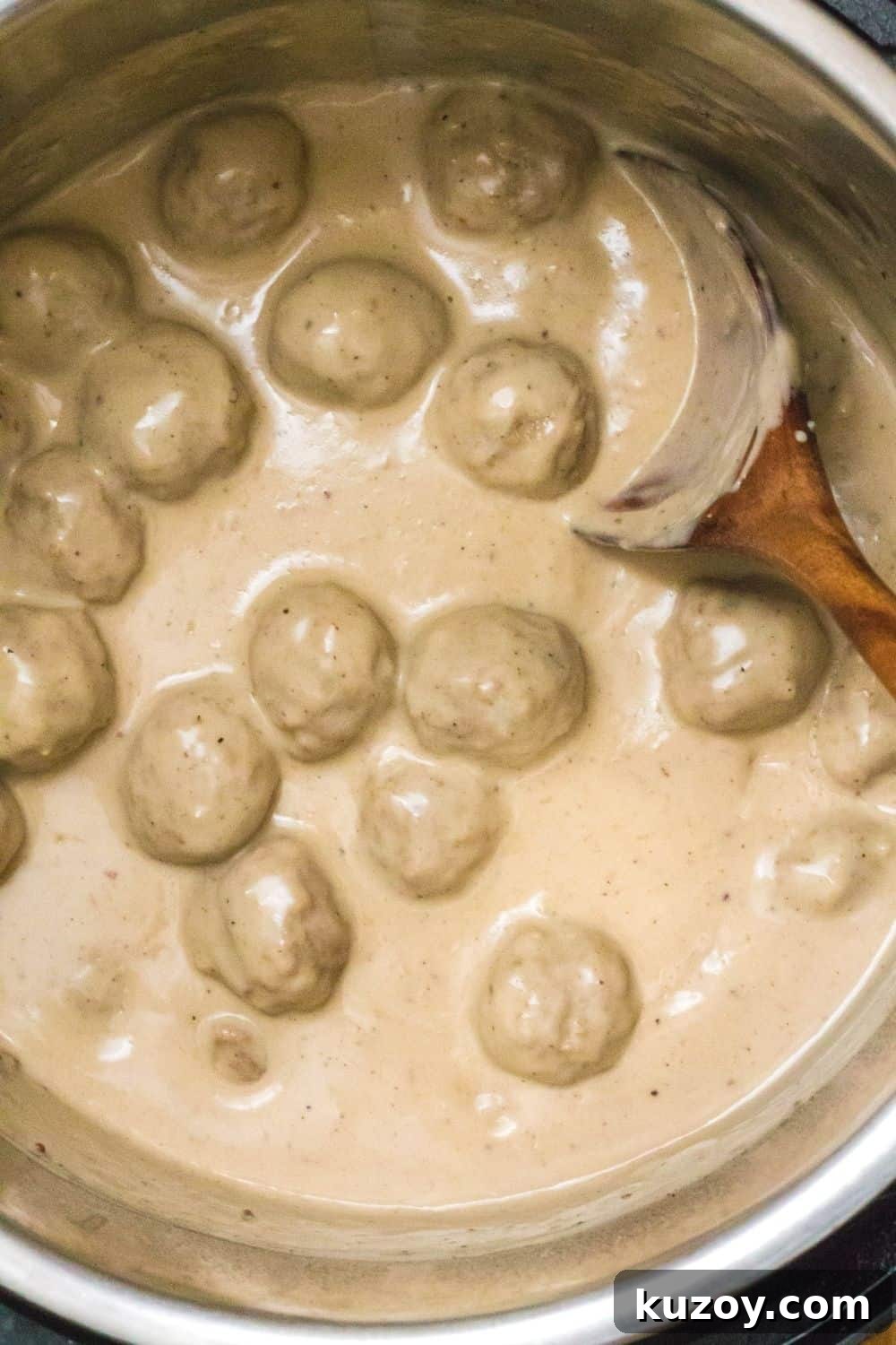 Instant Pot Swedish Meatballs Recipe: Creamy Sauce in 30 Minutes 8 overhead view of Instant Pot swedish meatballs in the pressure cooker's insert pot, ready to be served