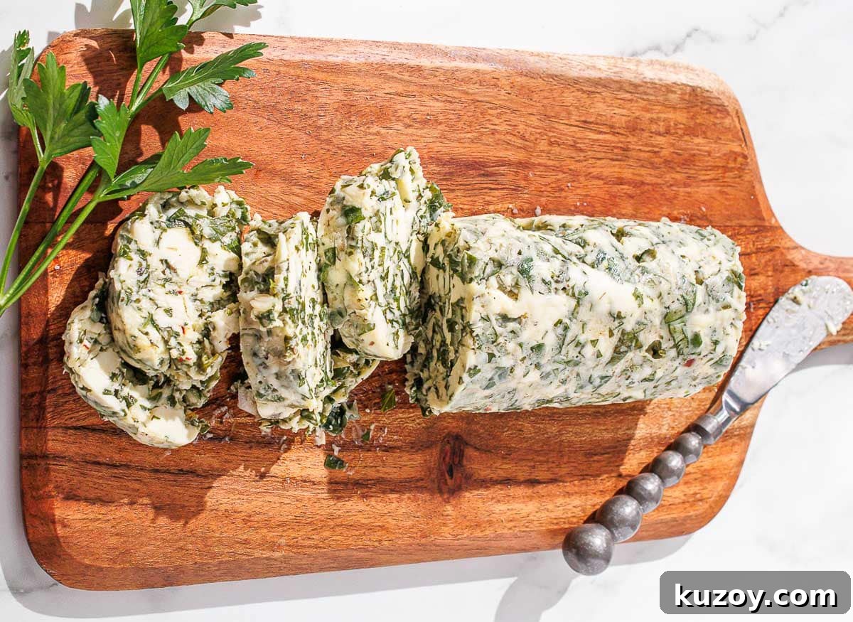 Horizontal shot of chimichurri butter on a wooden cutting board.