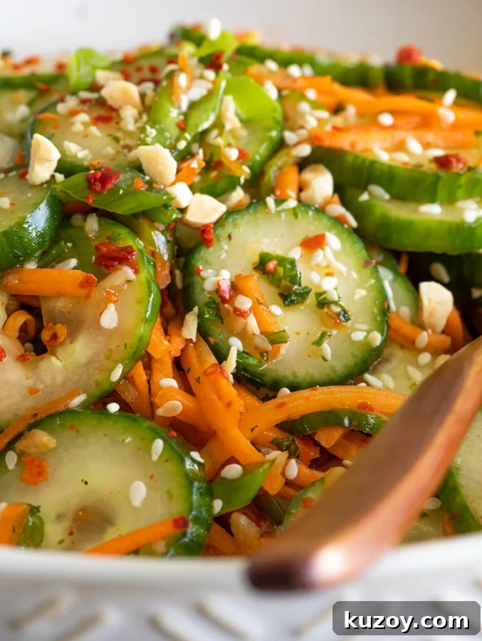 A picture of a bowl of carrot cucumber salad