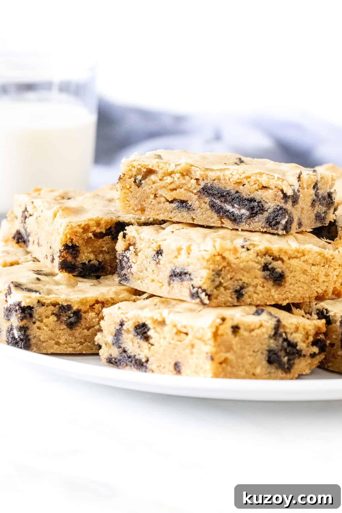 Oreo Blondies Recipe: Chewy Oreo-Stuffed Blondie Bars 2 Plate of Oreo blondies stacked on top of each other.