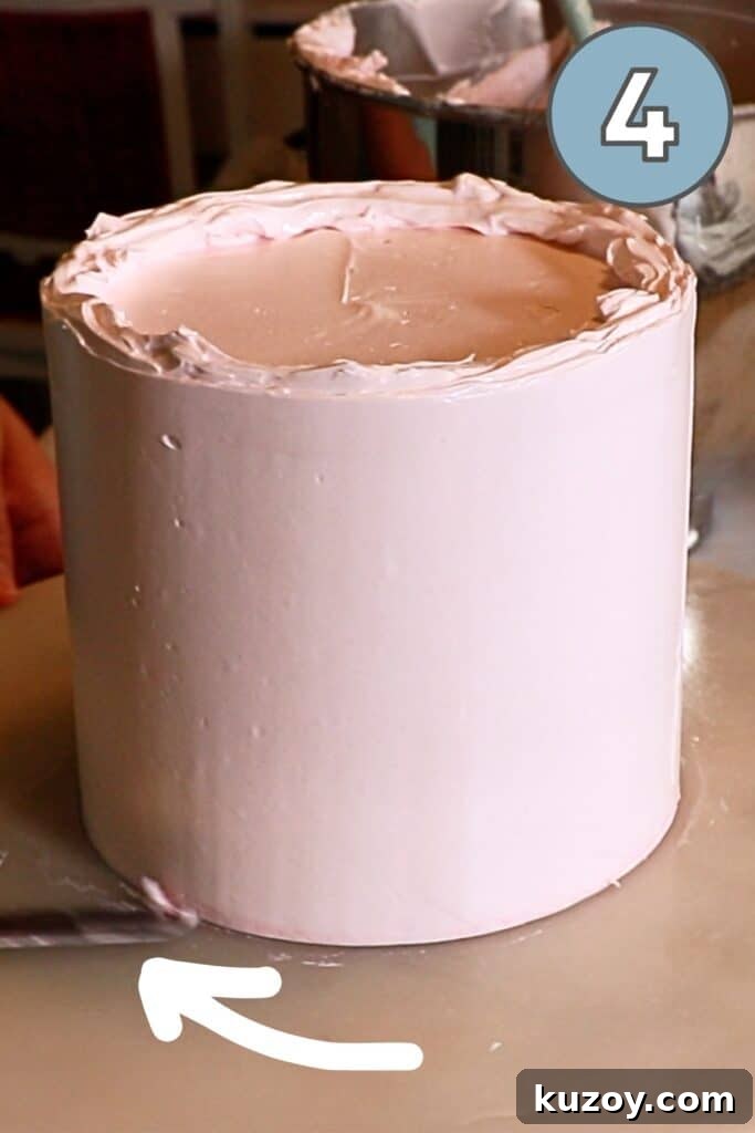 Vintage Pink Cake Ideas for Elegant Party Desserts 19 scraping off the excess buttercream on the bottom edge of the crumb coated cake