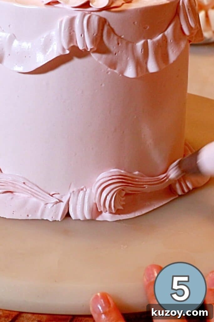 Vintage Pink Cake Ideas for Elegant Party Desserts 23 piping a shell with a star tip near the bottom edge of the cake