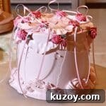 Vintage Pink Cake Ideas for Elegant Party Desserts 37 a pink vintage cake on a turning table