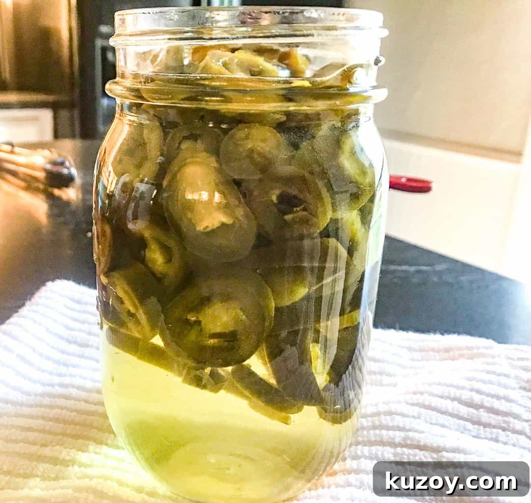 Candied jalapenos in mason jar