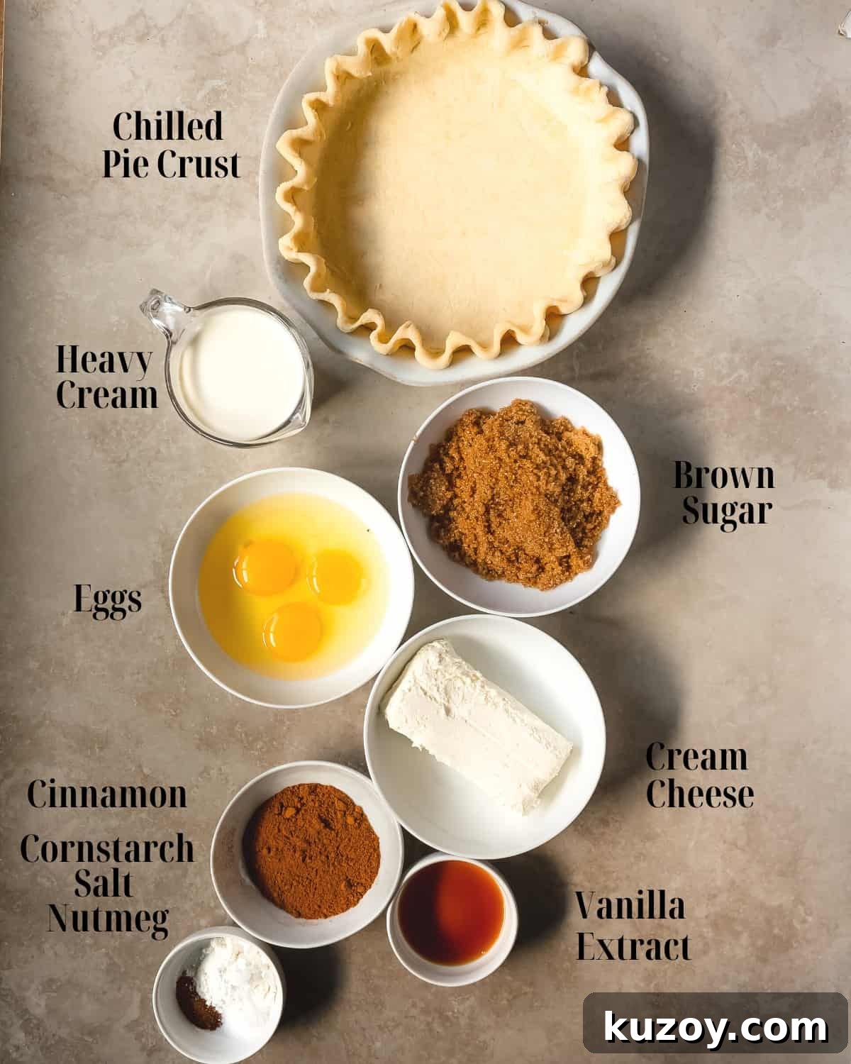 Gather a premade pie crust, cream cheese, brown sugar, eggs, vanilla extract, cinnamon, nutmeg, cornstarch, salt and heavy cream. 