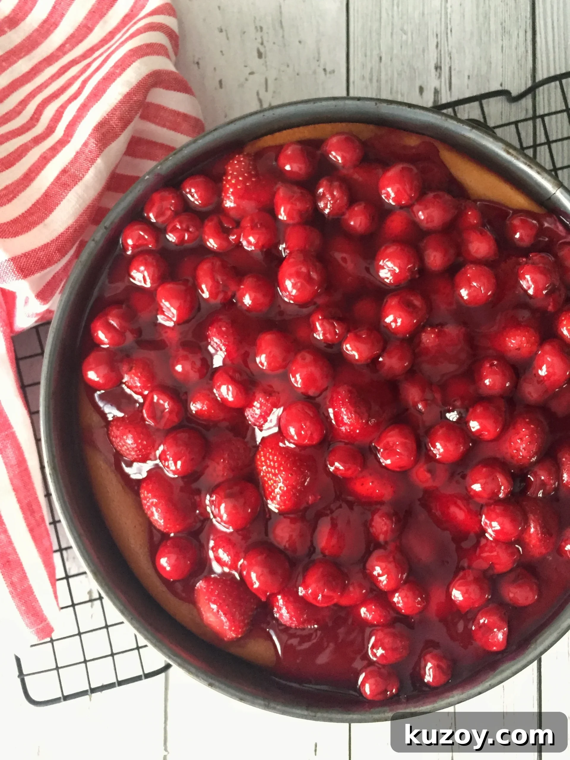 Classic Greek Cheesecake Recipe with Creamy Phyllo Crust 13 Cheesecake topped with strawberries and cherries