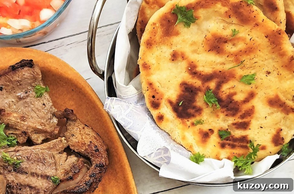 Buttery garlic naan bread in a balti dish.