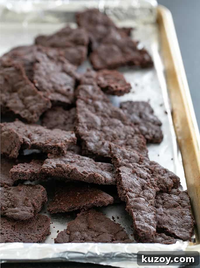 Brownie crisp baked on tray and broken into pieces