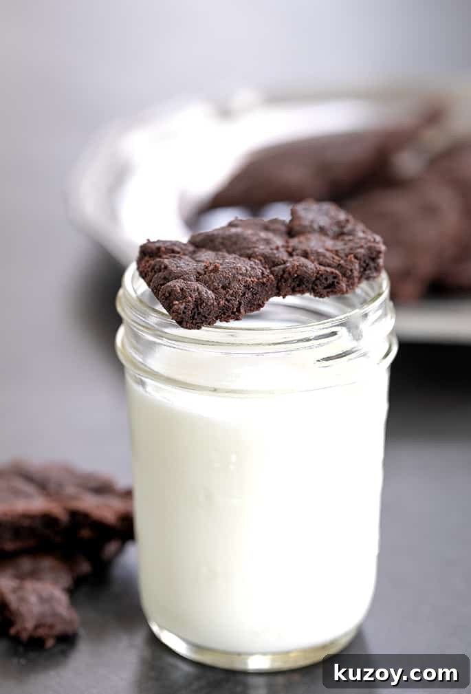 Gluten free brownie crisps on glass of milk