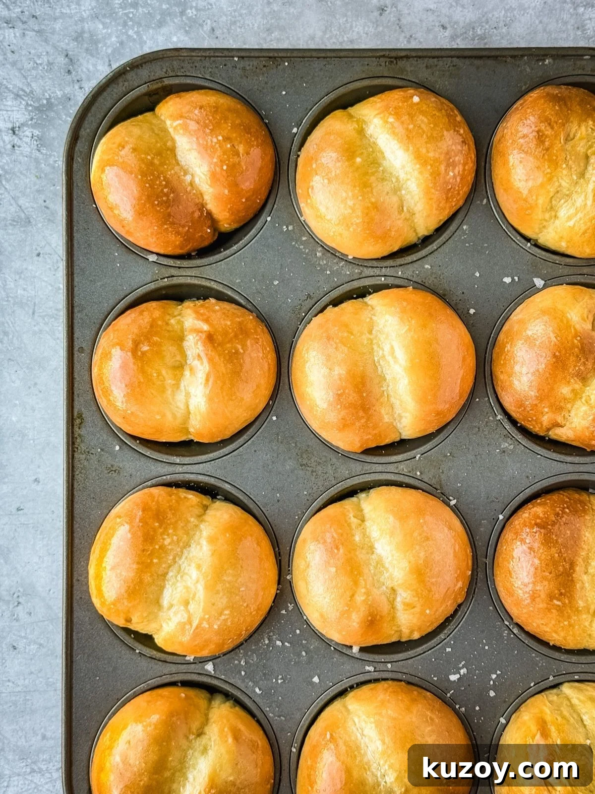 Soft, Buttery Double-Crust Dinner Rolls 2 Double cheeked buns in a muffin tin.