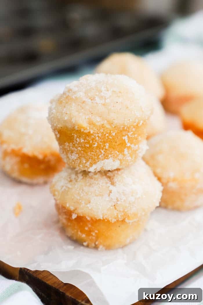 Sugar Donut Mini Muffins stacking on top of each other