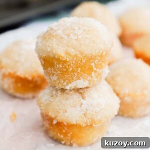 Sugar Donut Mini Muffins stacking on top of each other