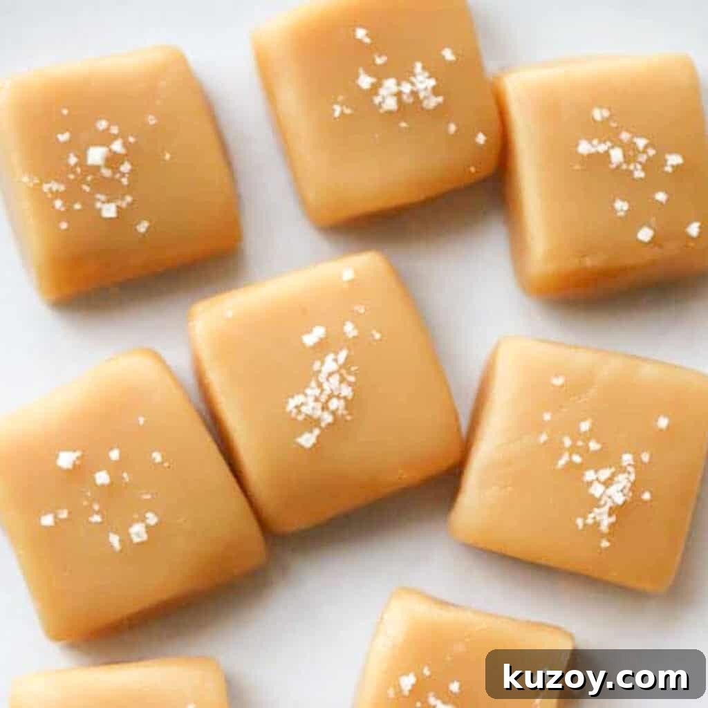 How to Make Classic Homemade Caramel Candy at Home 6 Small squares of homemade caramel candy topped with sea salt.