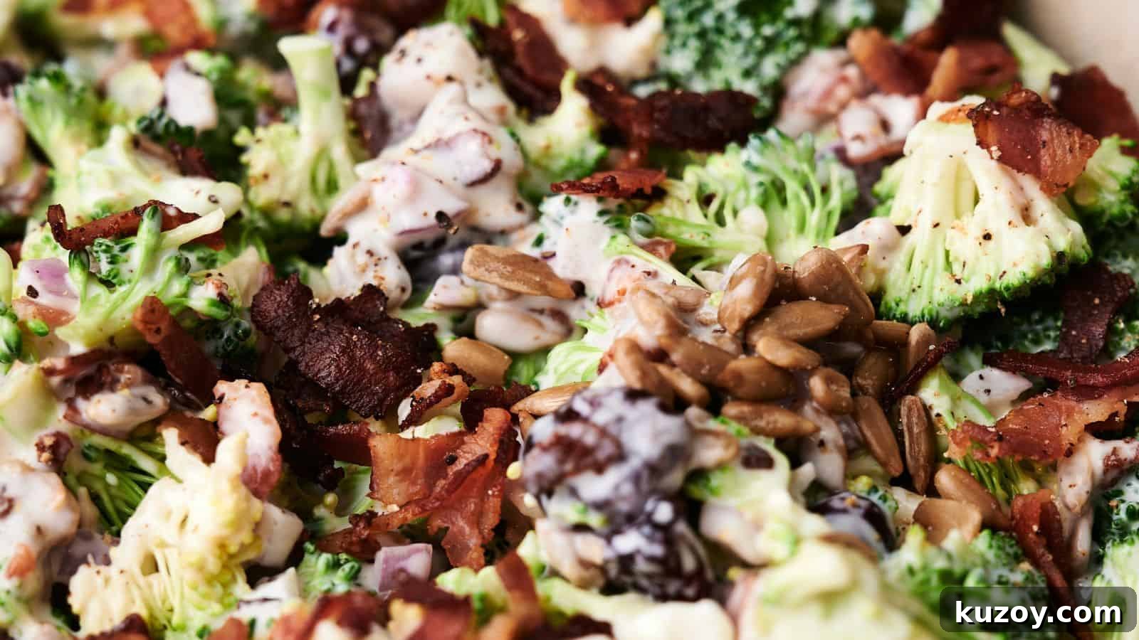 33 Must-Bring Thanksgiving Potluck Recipes for Every Year 21 Close-up of a delightful broccoli salad with crispy bacon, sunflower seeds, and a creamy dressing. Mixed ingredients are visible in detail, showcasing the vibrant textures and colors of this fresh broccoli salad.