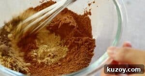 mixing 5 ingredients to make pumpkin spice