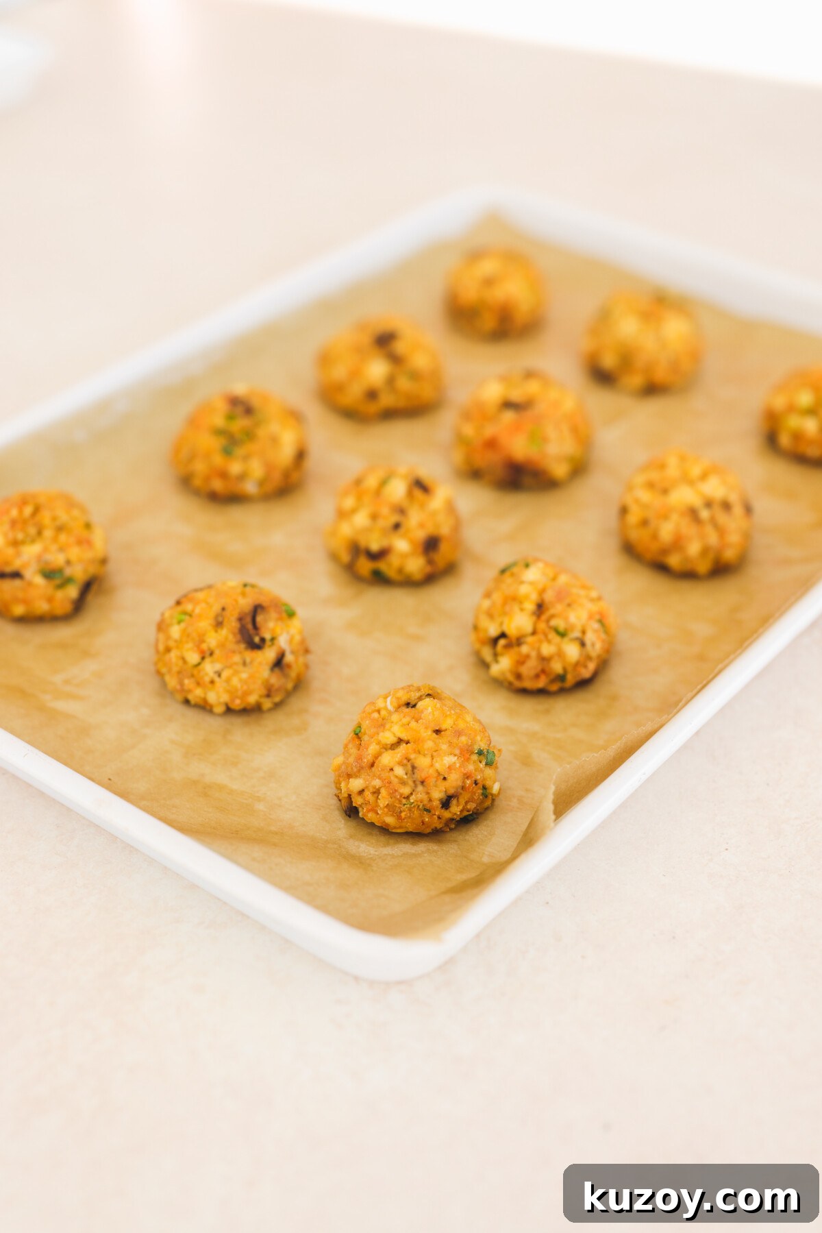 baked tofu balls on a baking sheet