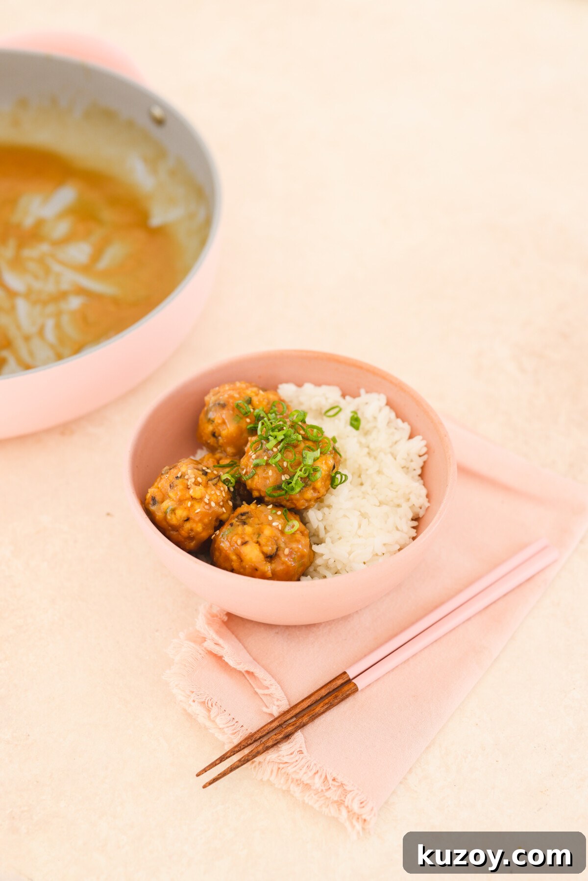 tofu meatballs in a pink bowl with rice